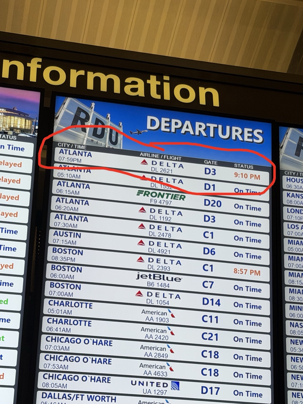 RDU departures information board photographed at the airport, with a hand-drawn red circle marking the top two Atlanta Delta flights: DL 2621 at 7:59 PM from gate D3 showing a delayed status of 9:10 PM, and DL 1552 at 5:10 AM from gate D1 showing On Time. Additional departures to Boston, Charlotte, Chicago O'Hare, Austin, and Dallas/Ft Worth are listed below