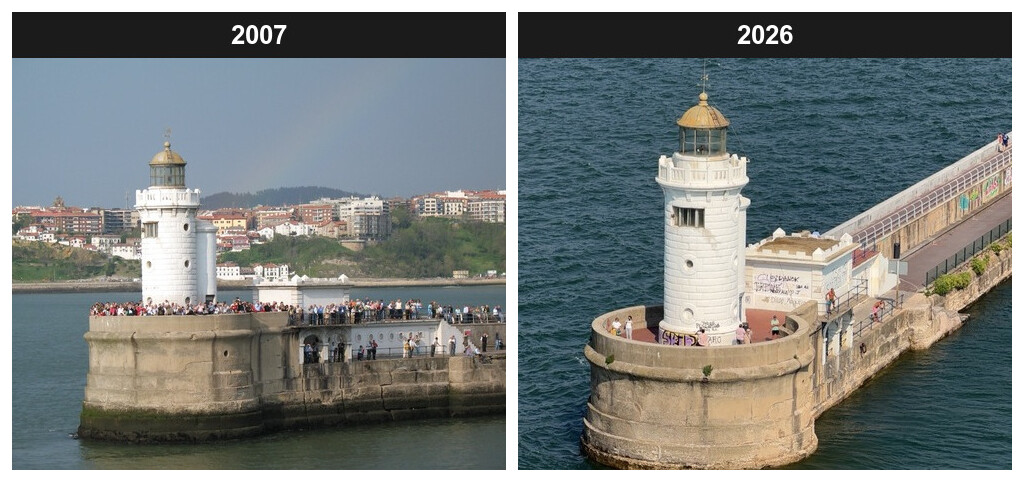 A two-panel side-by-side comparison of the Faro del Rompeolas, the lighthouse at the end of the Getxo breakwater, nineteen years apart, each panel headed by a black bar with the year in white. The left panel, labelled 2007, shows the white lighthouse and its semicircular stone bastion crowded shoulder to shoulder with people along the parapet and out along the mole, the stonework clean and unmarked, with a hillside town of white and red-roofed buildings behind under a pale sky. The right panel, labelled 2026, shows the same tower and bastion from a similar angle in bright summer light, now with coloured graffiti sprayed across the base of the tower and the small building beside it, only a scattering of people on the bastion, and the mole running away to the right past a white railing.